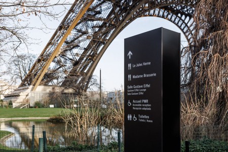 View of the gardens and a pillar of the Eiffel Tower